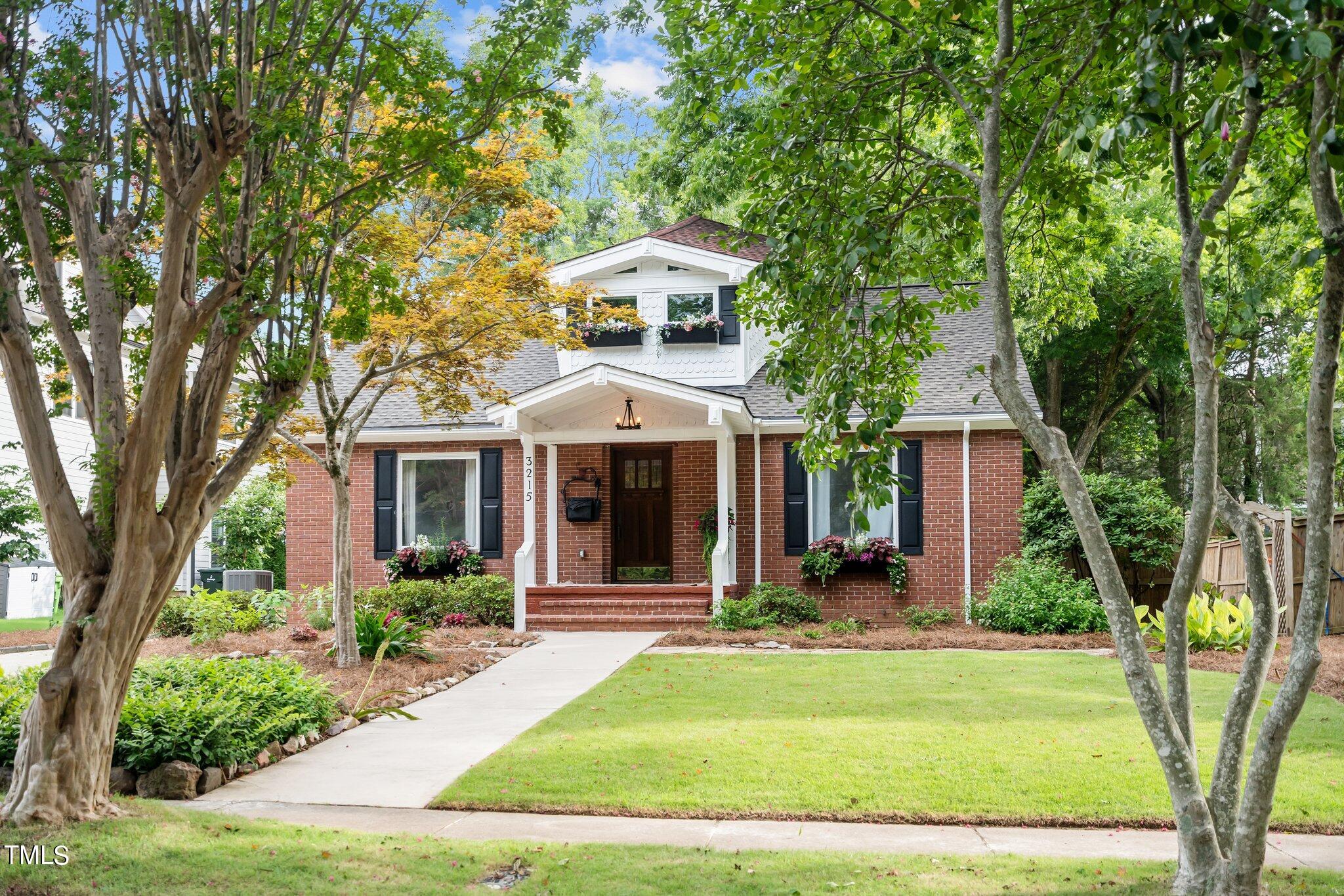 3215 Merriman Avenue Raleigh, NC 27607 - Photo 54 of 66 a front view of a house with garden