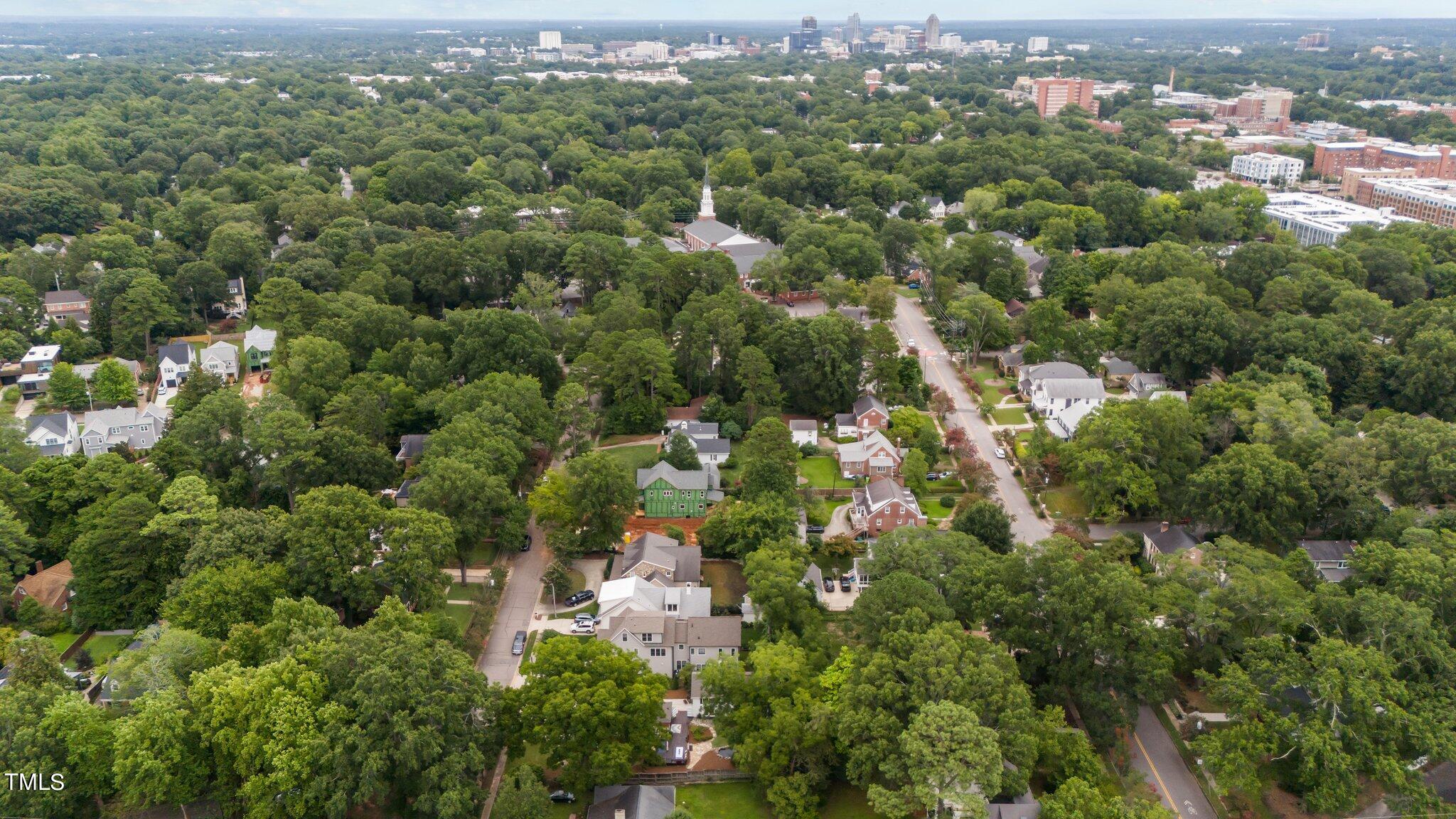 3215 Merriman Avenue Raleigh, NC 27607 - Photo 56 of 66 an aerial view of a city with lots of residential buildings and green landscape
