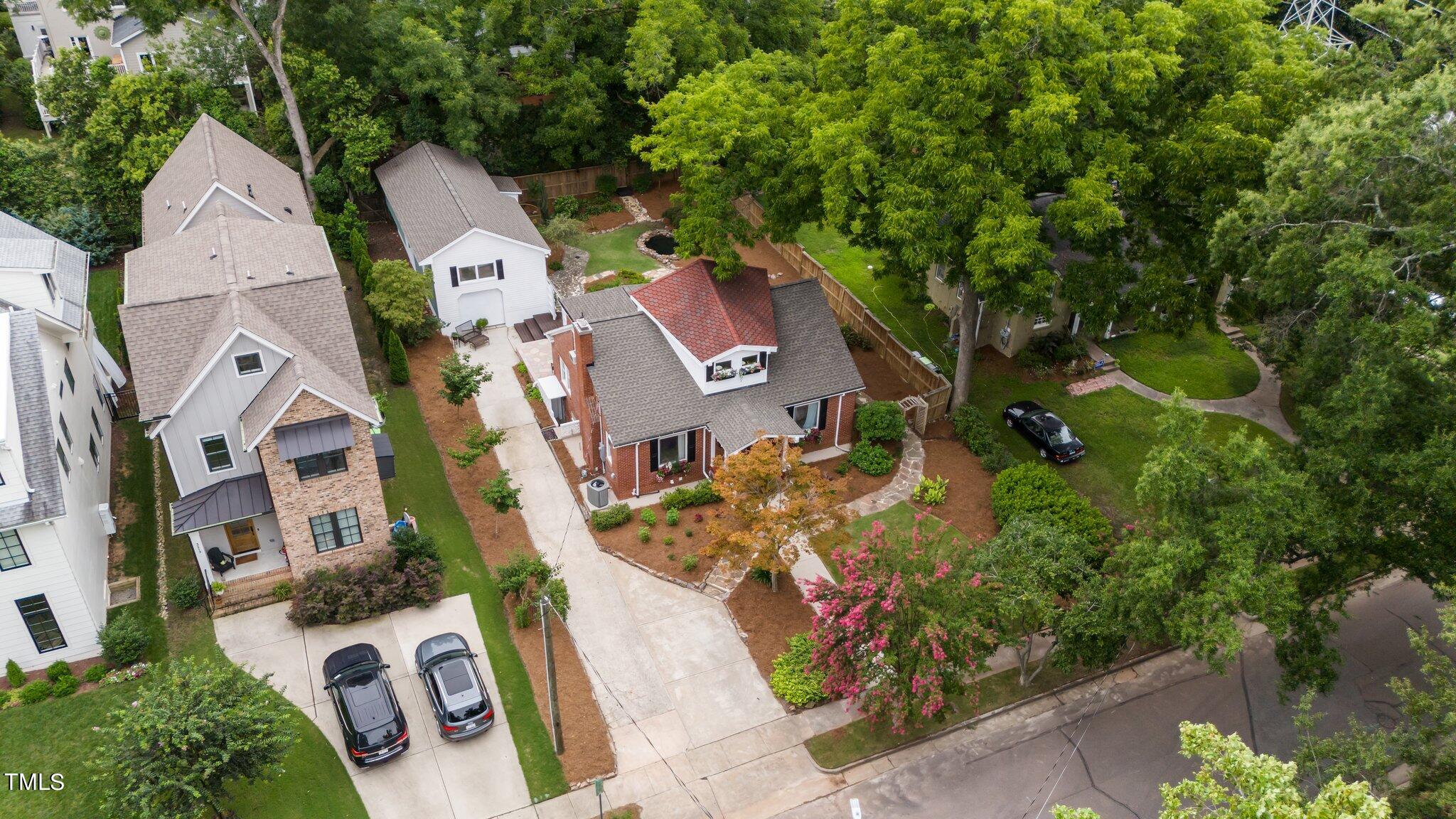 3215 Merriman Avenue Raleigh, NC 27607 - Photo 60 of 66 an aerial view of residential house with outdoor space and trees all around
