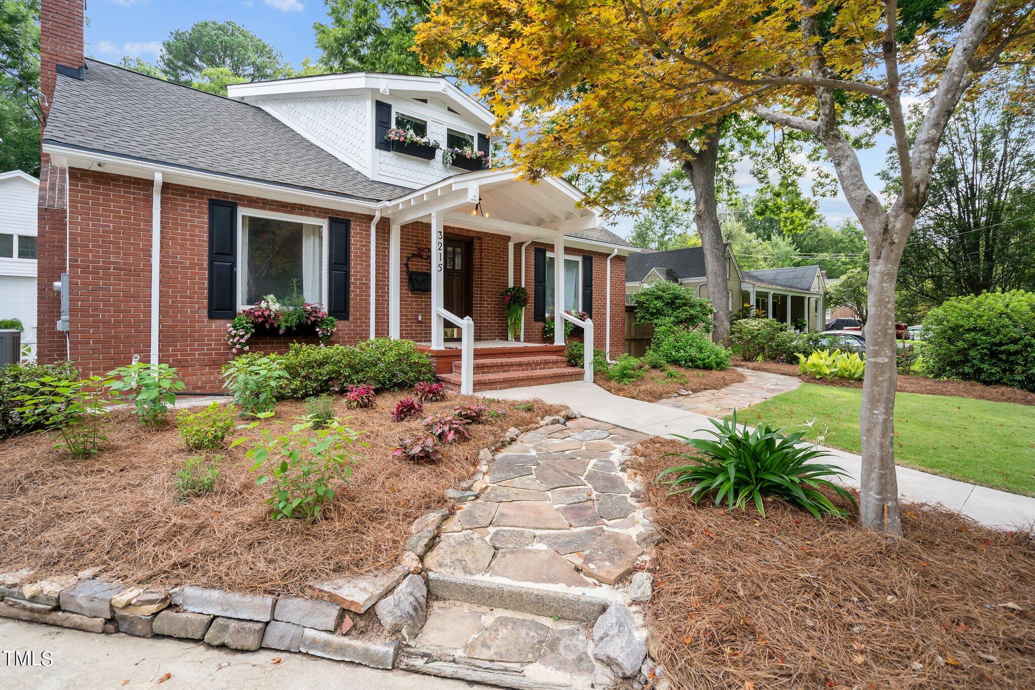 3215 Merriman Avenue Raleigh, NC 27607 - Photo 62 of 66 a front view of a house with garden