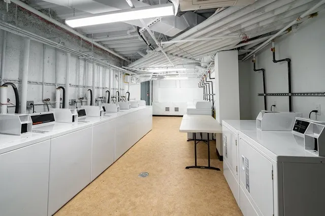 a kitchen with a sink and a refrigerator