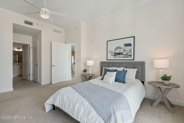 a bedroom with a bed and chair