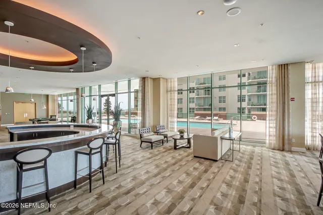 a bathroom with a tub sink and a mirror