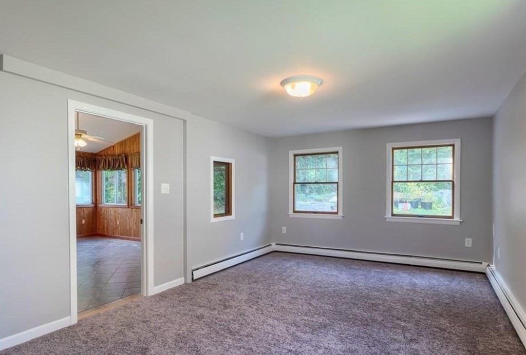 142 East Meadow Road Lowell, MA 01854 - Photo 5 of 28 an empty room with windows and closet