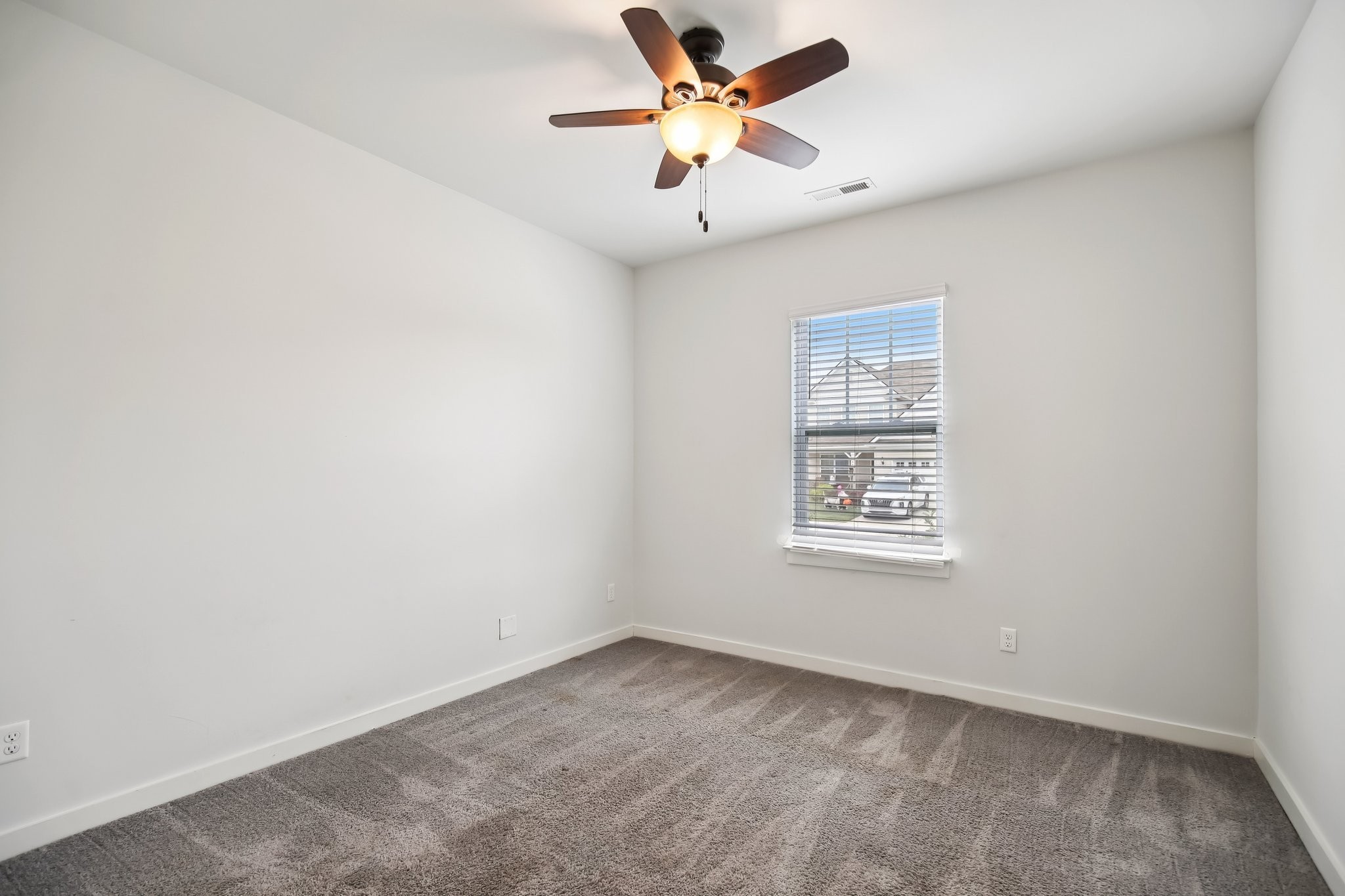 403 Wind Dance Drive Lebanon, TN 37087 - Photo 18 of 66 an empty room with a window and a fan