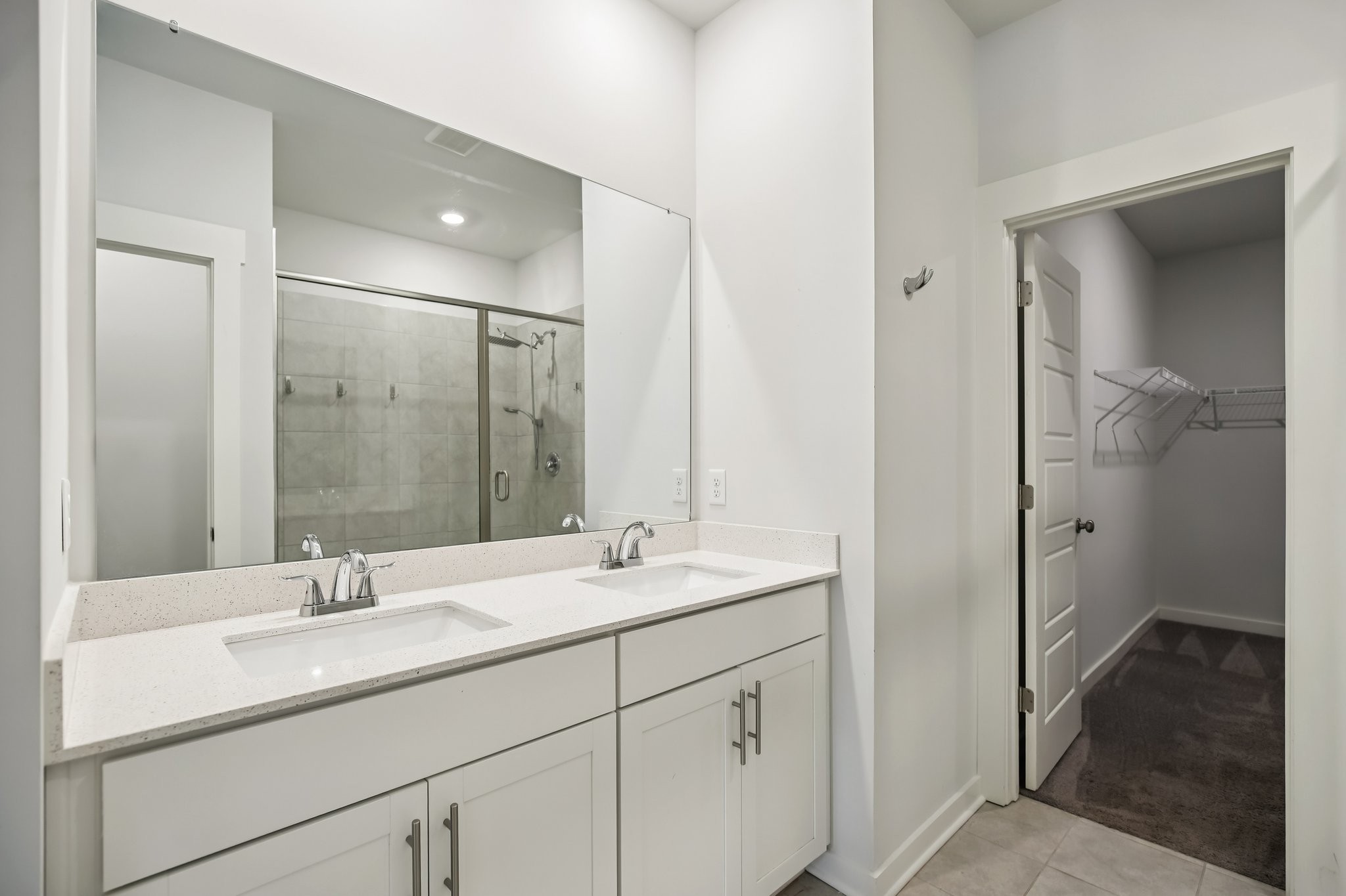 403 Wind Dance Drive Lebanon, TN 37087 - Photo 46 of 66 a bathroom with double sink and a mirror