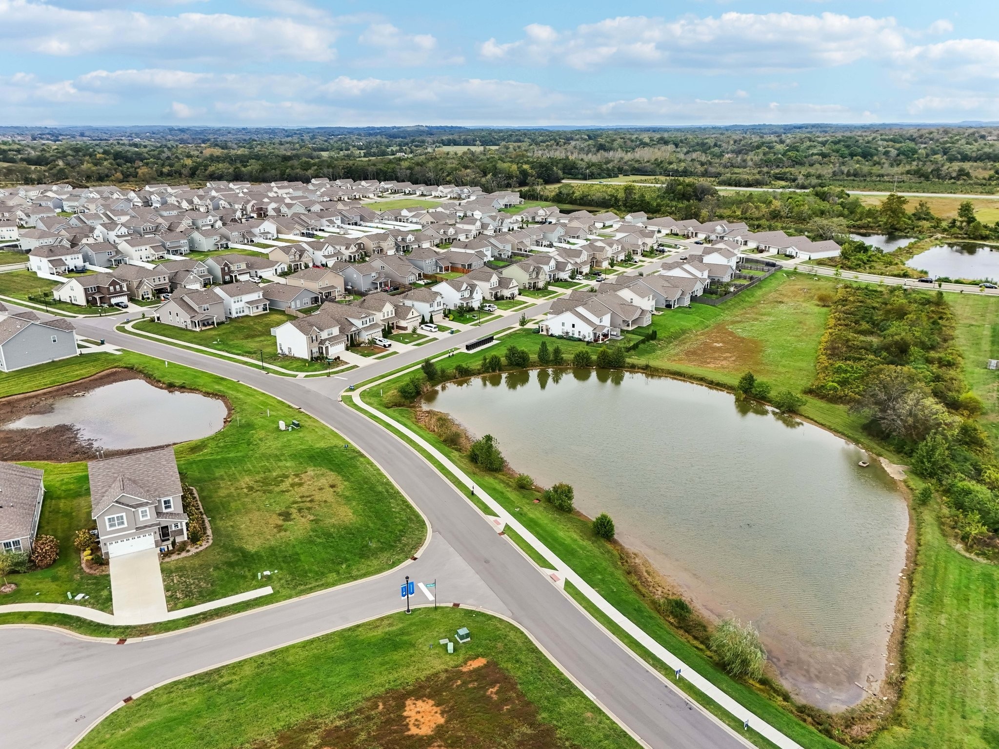 403 Wind Dance Drive Lebanon, TN 37087 - Photo 58 of 66 an aerial view of residential houses with outdoor space and river