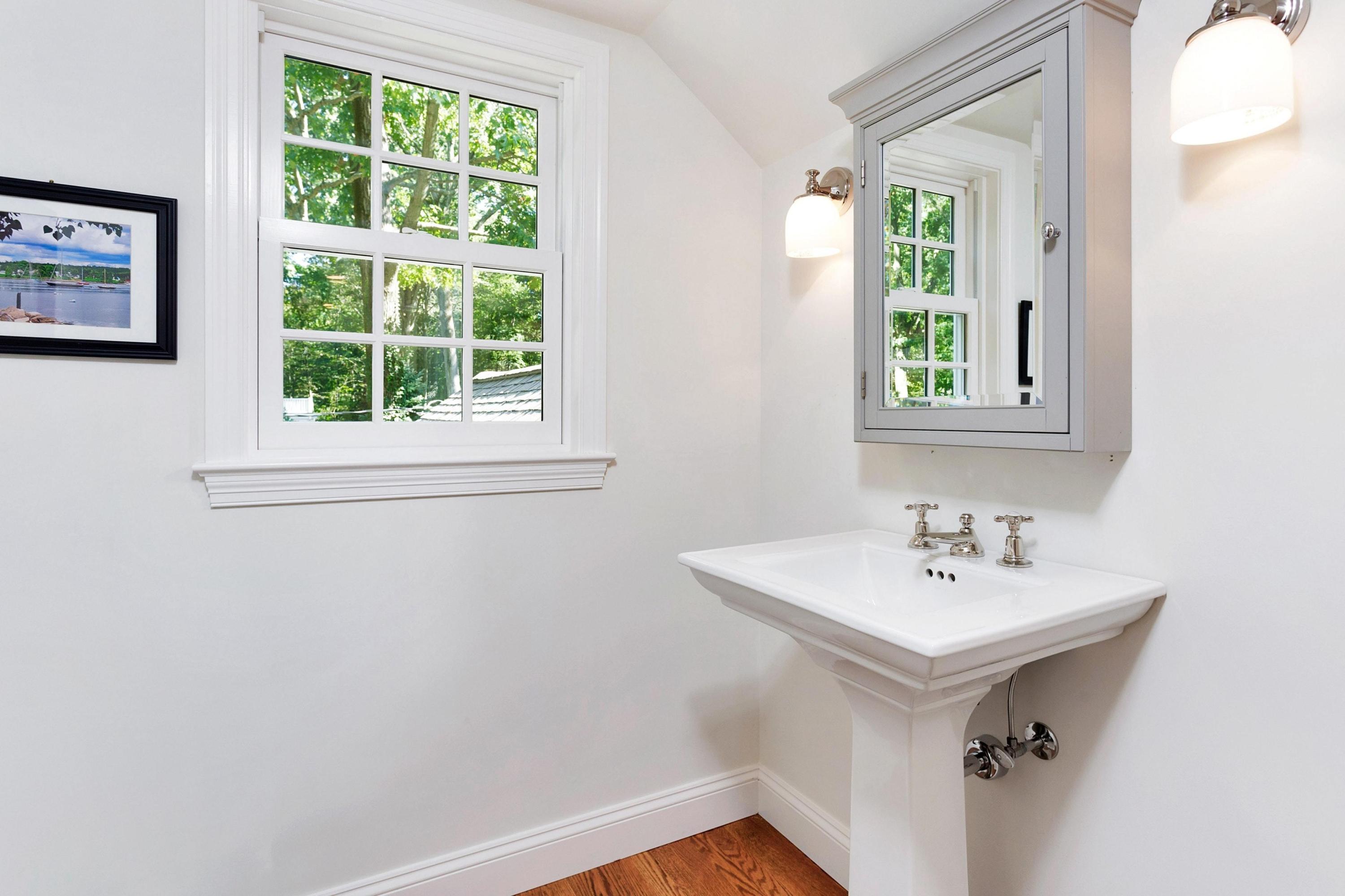 44 Deepwood Road Darien, CT 06820 - Photo 19 of 45 a bathroom with a sink and a window