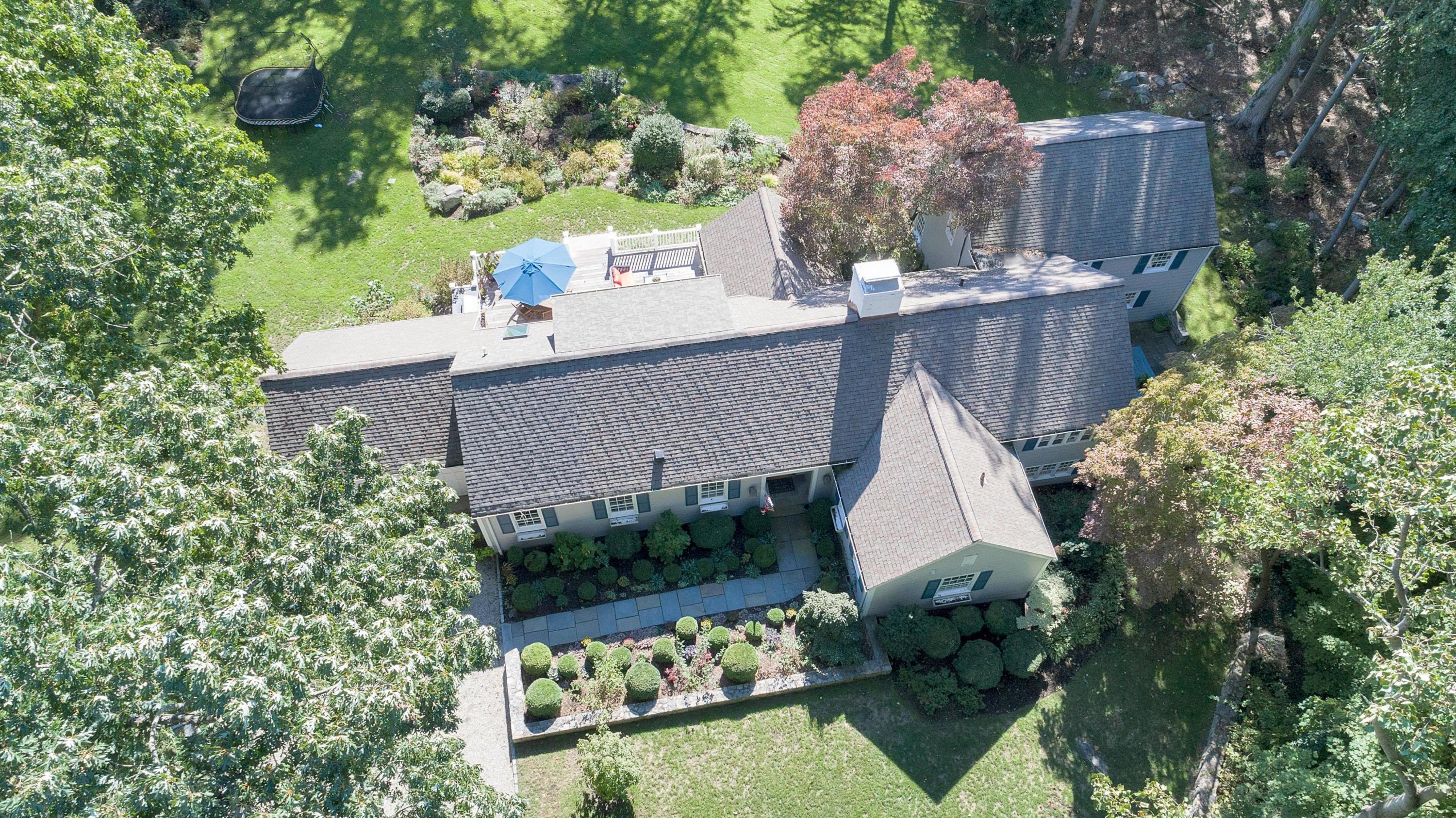 44 Deepwood Road Darien, CT 06820 - Photo 3 of 45 aerial view of a house with a yard and potted plants