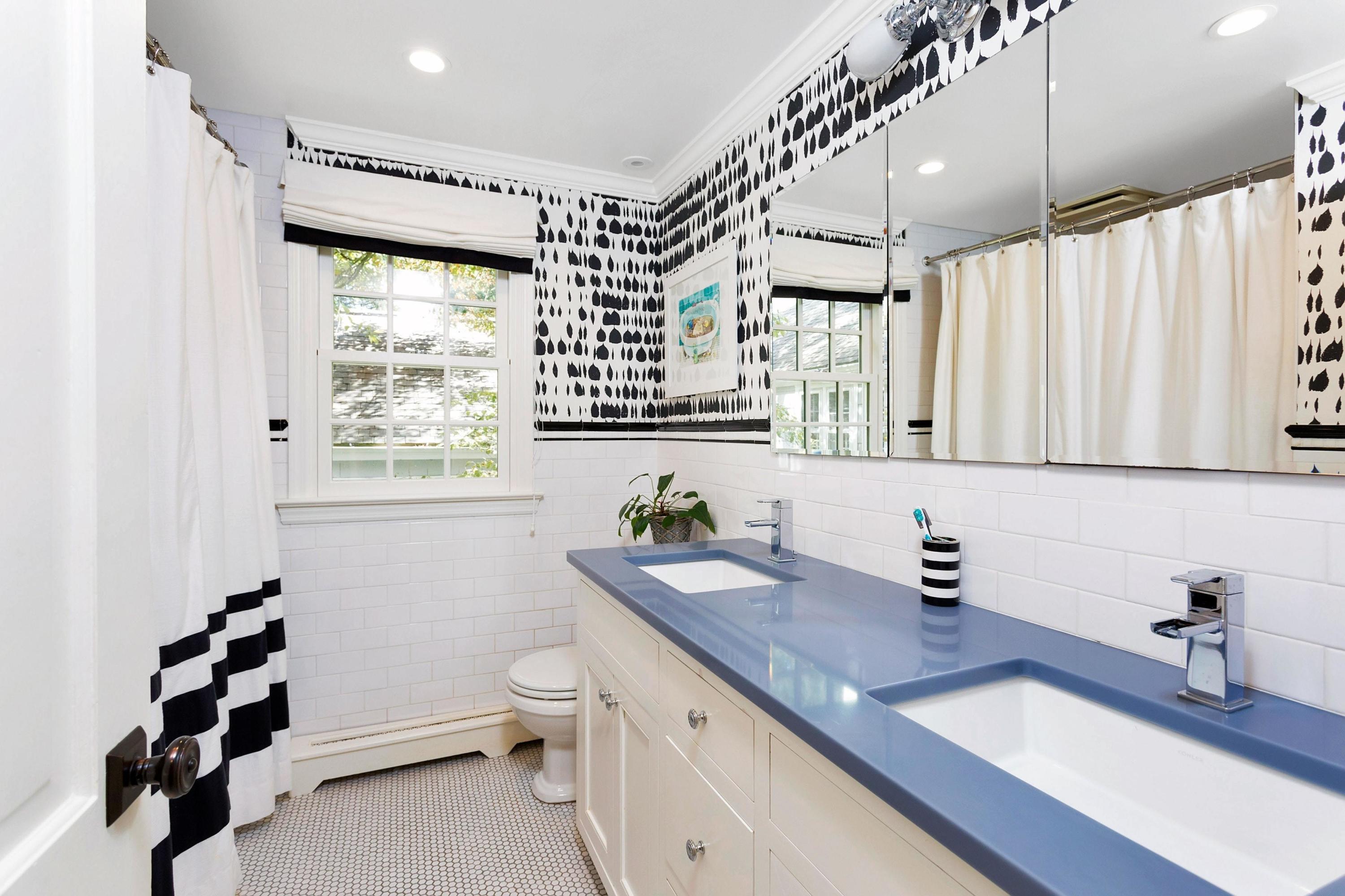 44 Deepwood Road Darien, CT 06820 - Photo 24 of 45 a bathroom with a granite countertop sink a toilet and a window