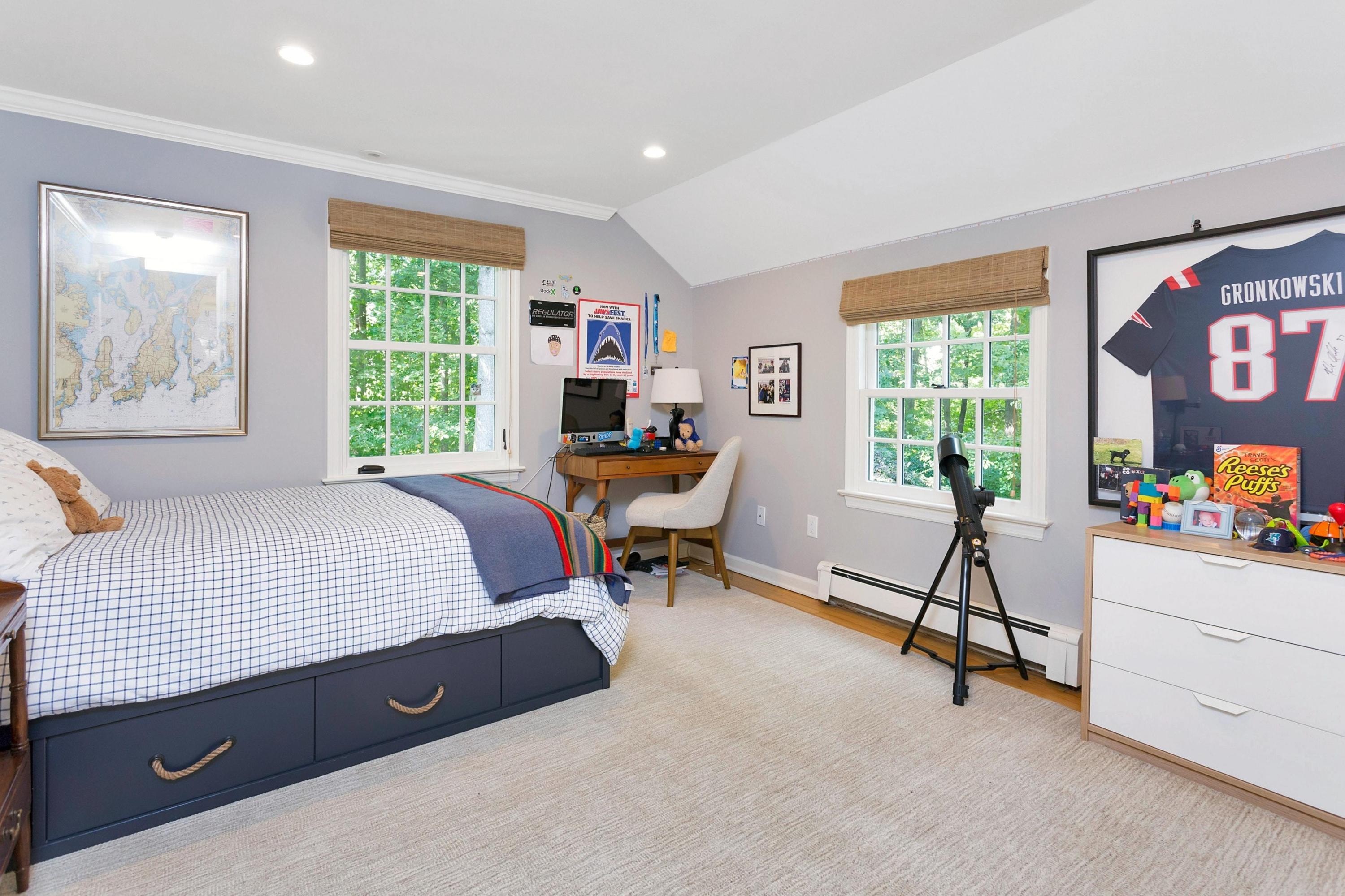 44 Deepwood Road Darien, CT 06820 - Photo 26 of 45 a living room with furniture and a flat screen tv