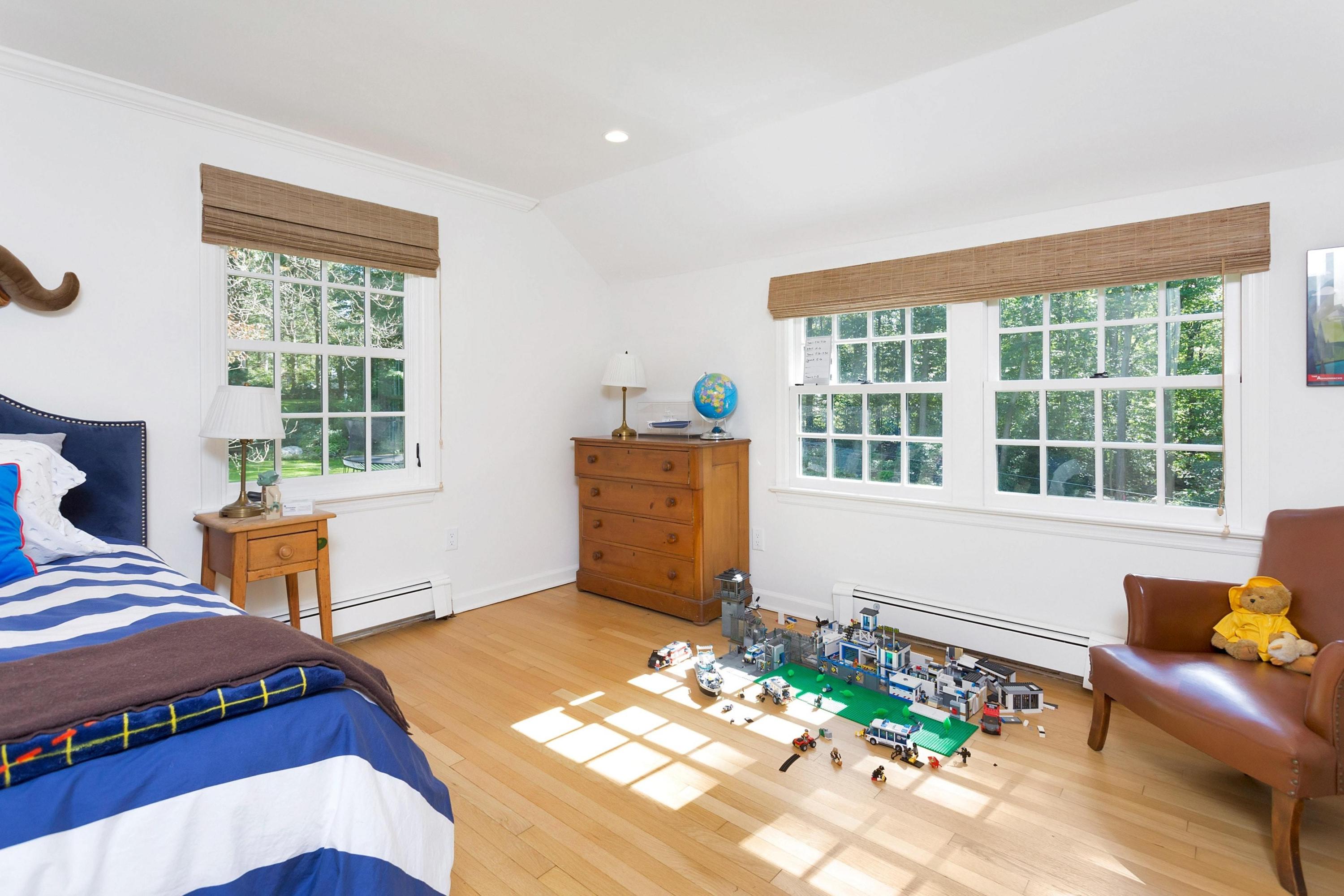 44 Deepwood Road Darien, CT 06820 - Photo 27 of 45 a bedroom with a bed and windows