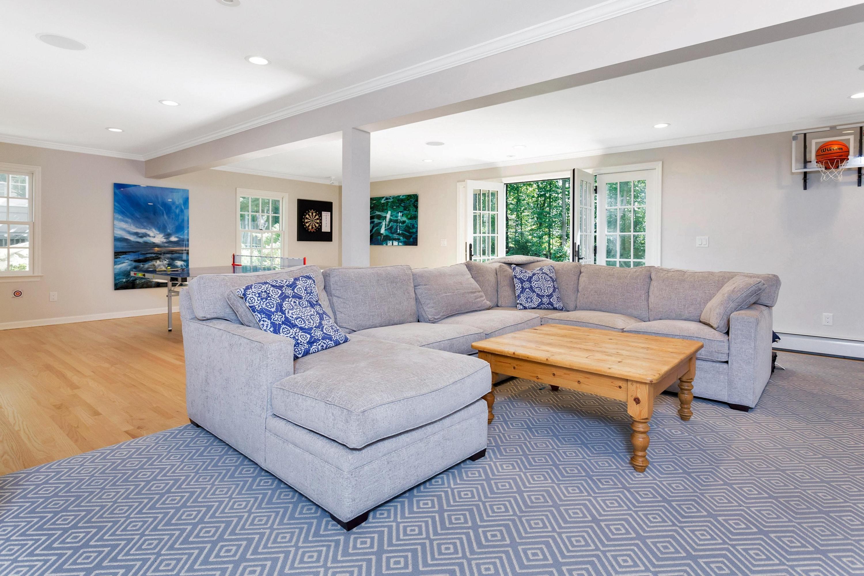 44 Deepwood Road Darien, CT 06820 - Photo 28 of 45 a living room with furniture and a large window