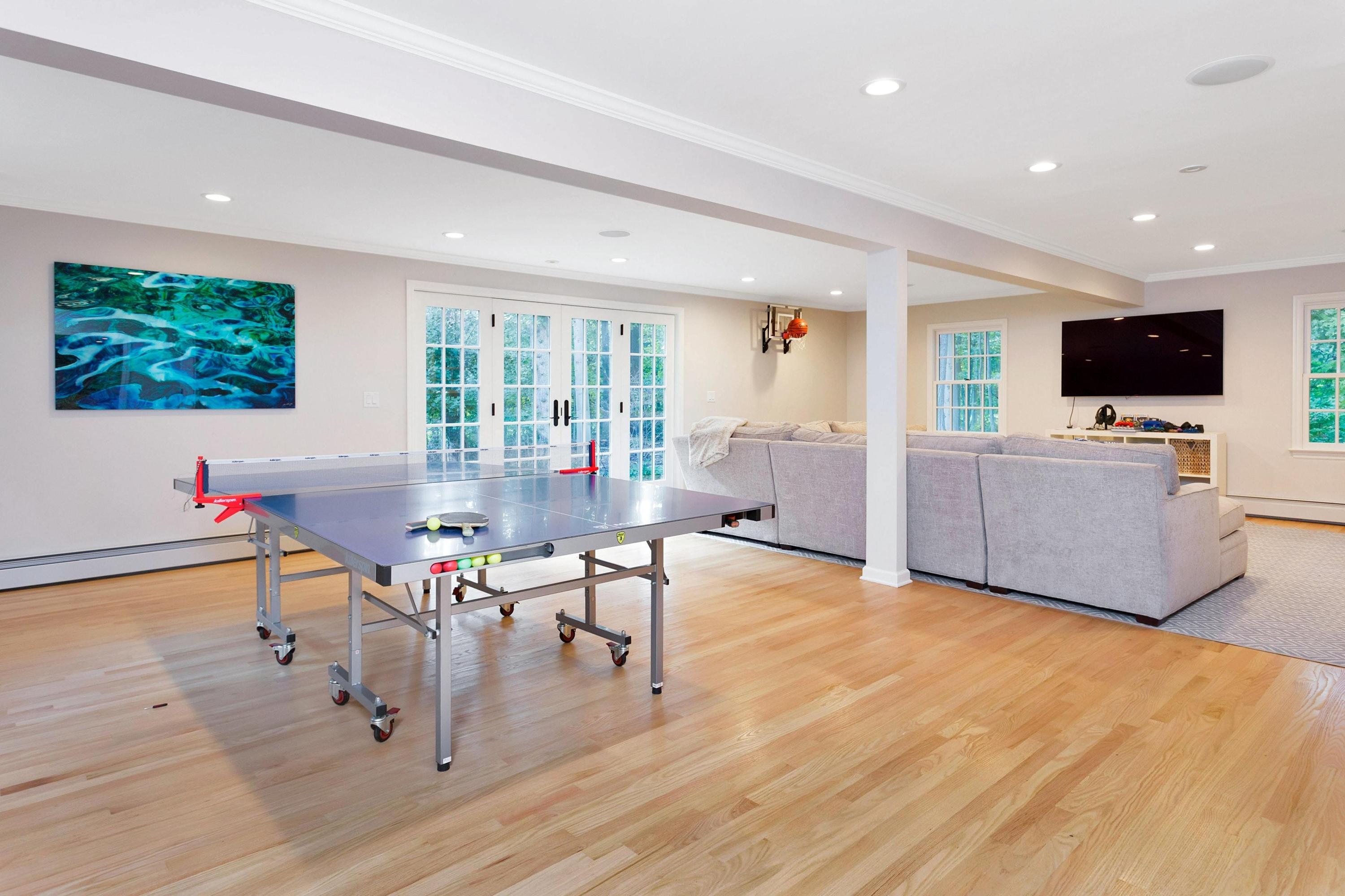 44 Deepwood Road Darien, CT 06820 - Photo 29 of 45 a living room with furniture and a flat screen tv