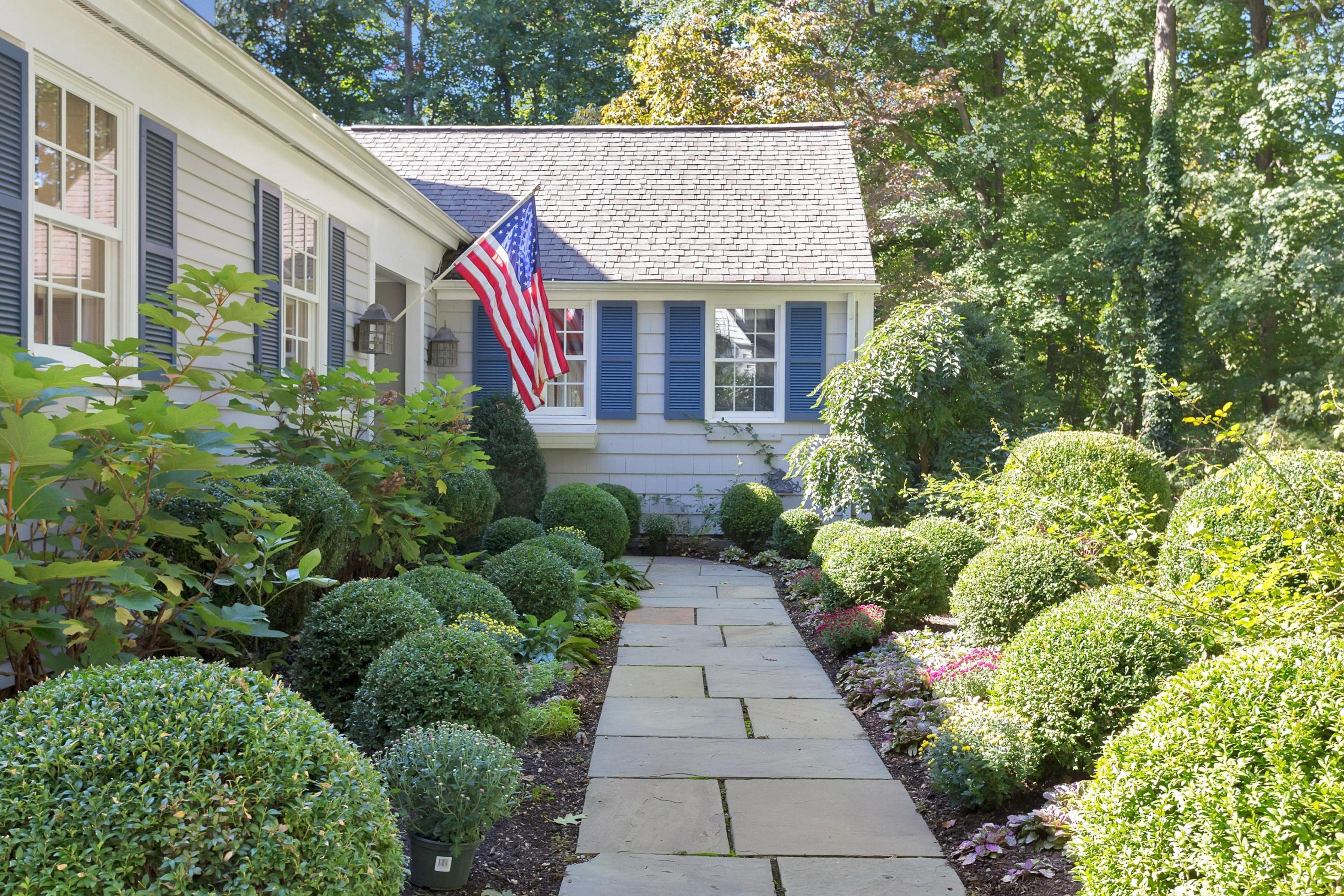 44 Deepwood Road Darien, CT 06820 - Photo 4 of 45 a view of a house with potted plants