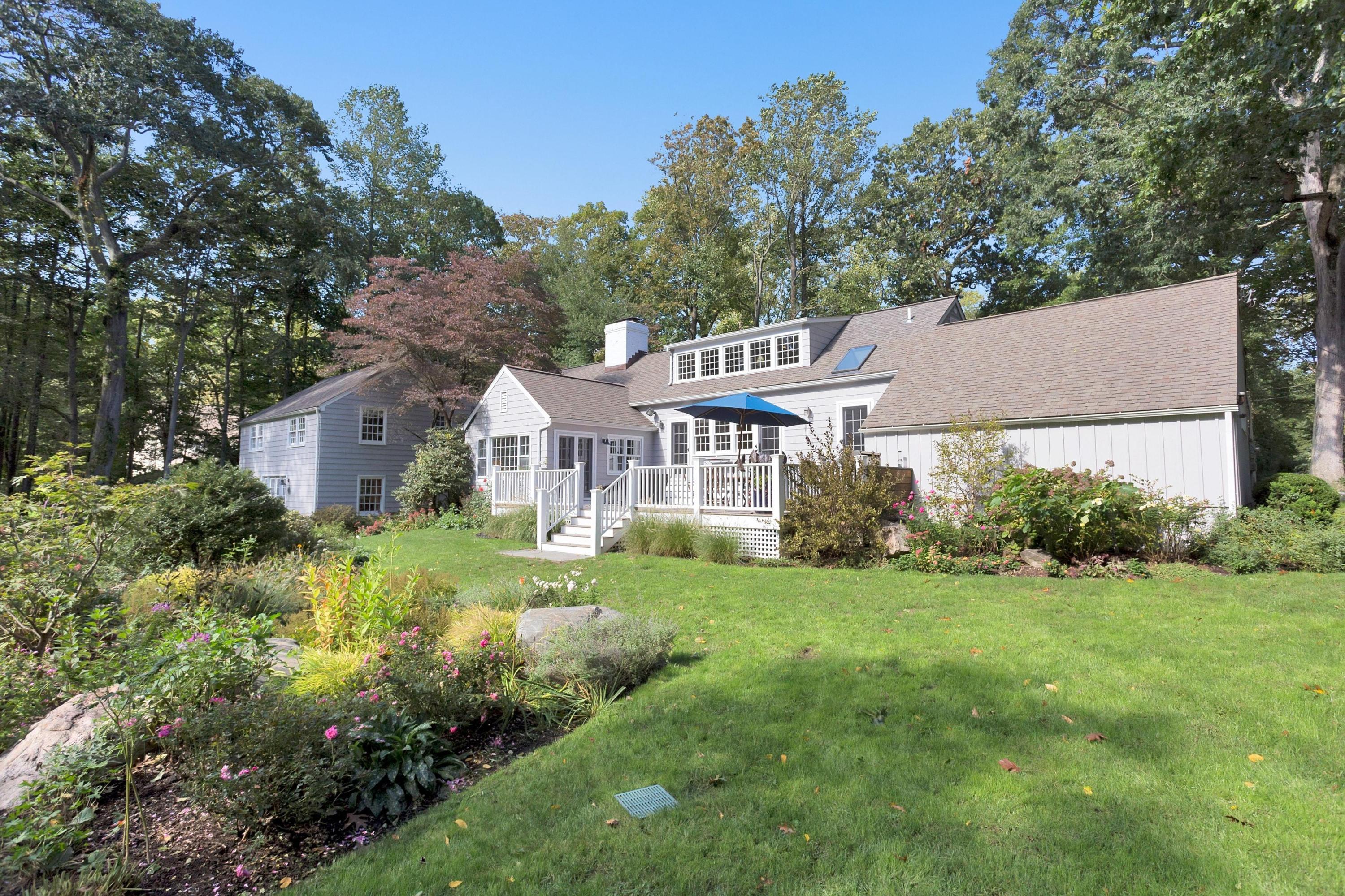 44 Deepwood Road Darien, CT 06820 - Photo 34 of 45 a front view of a house with garden