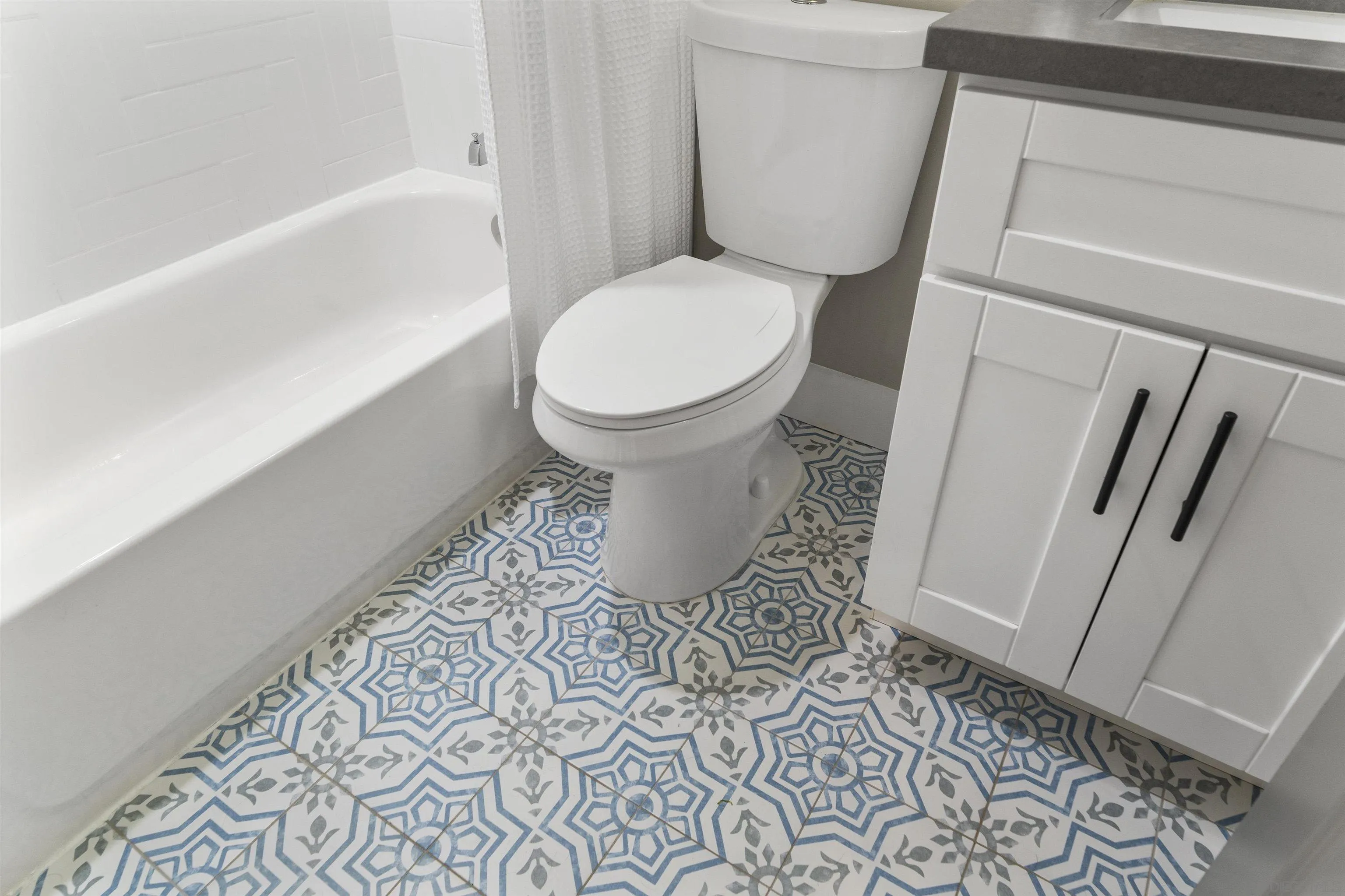 1007 Holly Avenue Imperial Beach, CA 91932 - Photo 22 of 39 a bathroom with a toilet and a shower