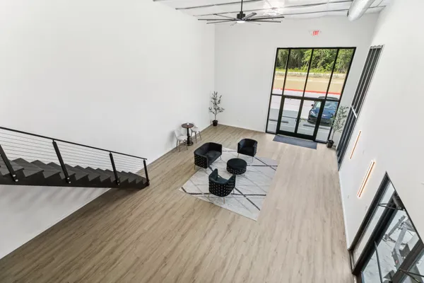 a view of entryway and hall with wooden floor