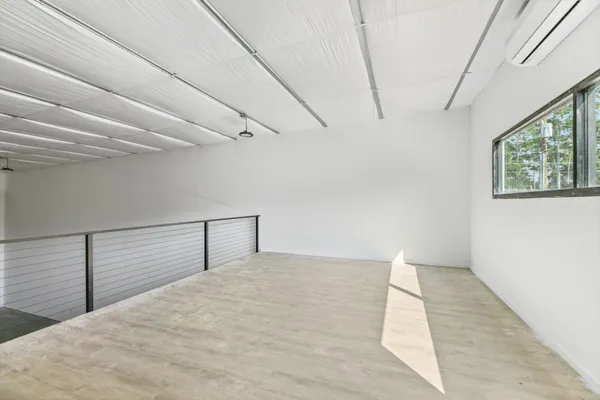 a view of empty room with windows