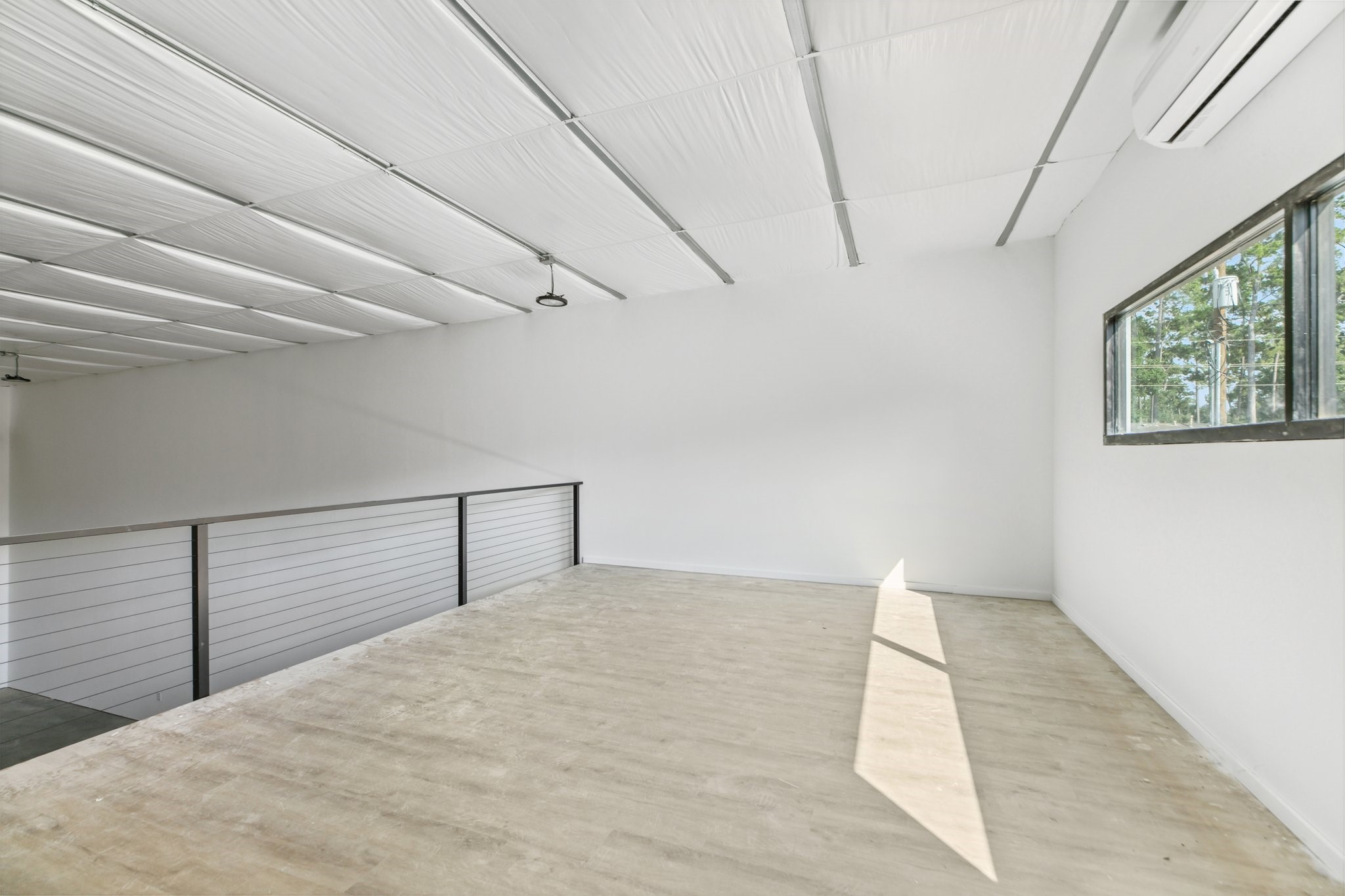 12402 Malcomson Road Houston, TX 77070 - Photo 17 of 50 a view of empty room with windows