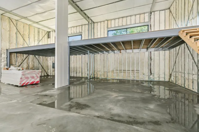 a view of a backyard space with wooden roof and stairs
