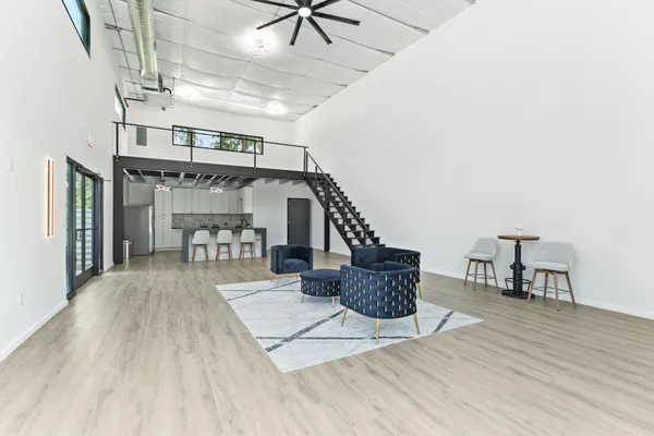 a view of entryway livingroom and hall with wooden floor