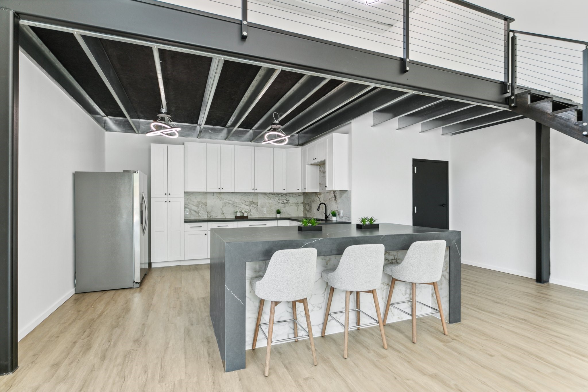 12402 Malcomson Road Houston, TX 77070 - Photo 6 of 50 a kitchen with a sink cabinets and wooden floor