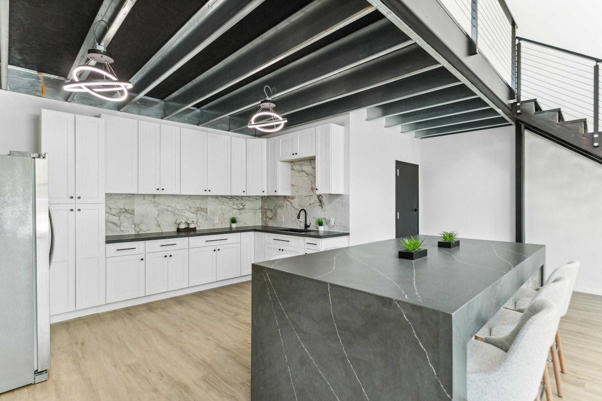 12402 Malcomson Road Houston, TX 77070 - Photo 7 of 50 a kitchen with stainless steel appliances granite countertop a sink a stove and cabinets