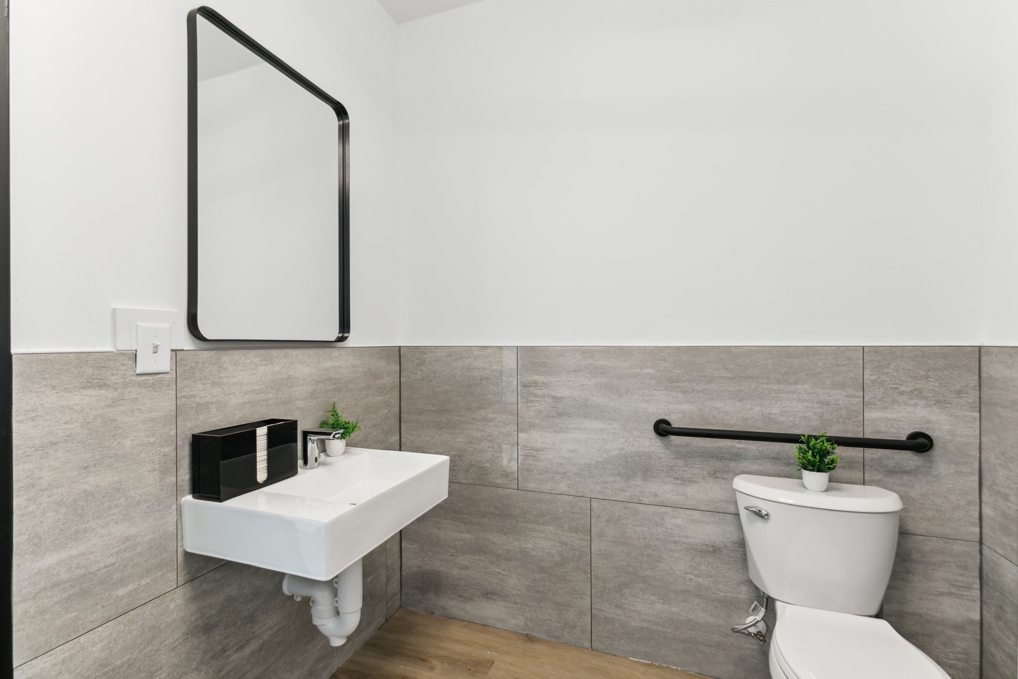12402 Malcomson Road Houston, TX 77070 - Photo 10 of 50 a bathroom with a toilet a sink and a mirror