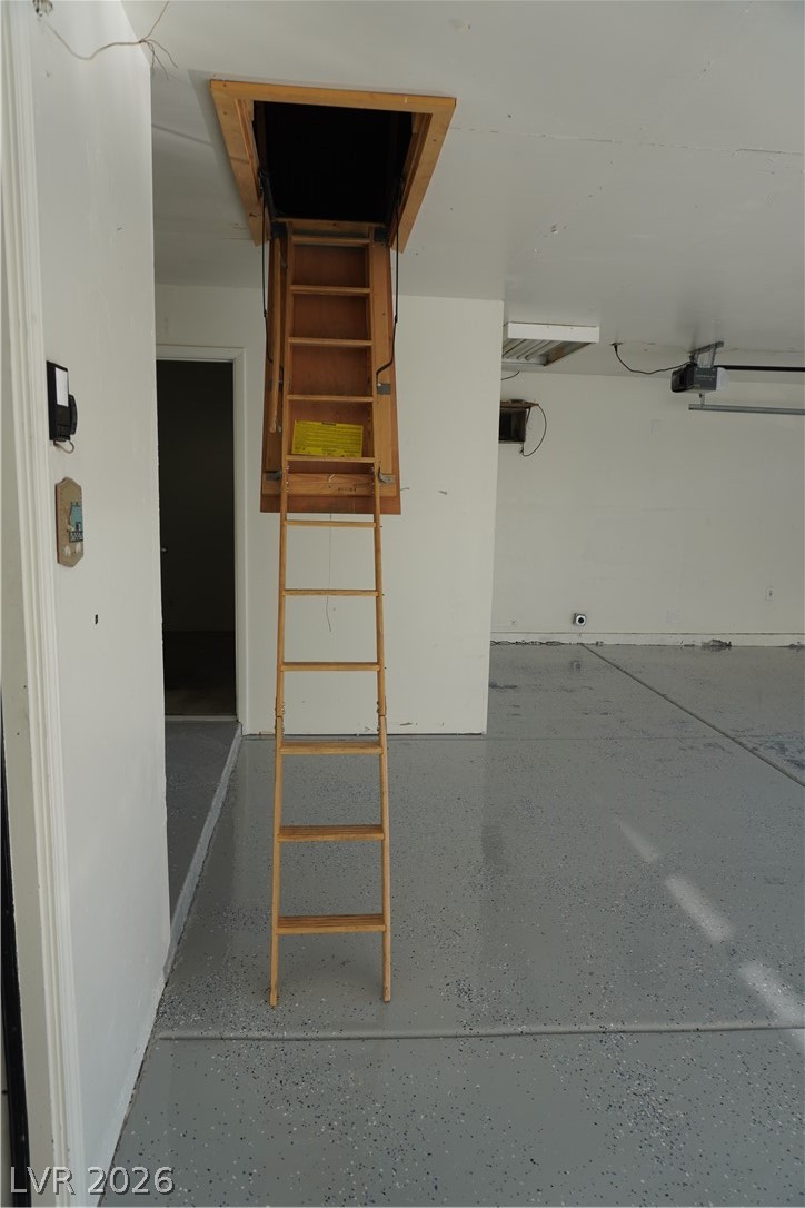 8328 Del Rey Avenue Las Vegas, NV 89117 - Photo 9 of 38 Access to attic storage is made easy with a pull-down ladder in this meticulously maintained garage.