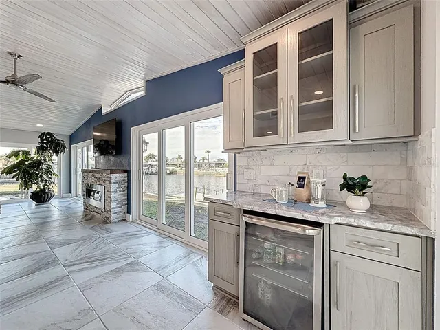 a kitchen with stainless steel appliances granite countertop a stove sink and cabinets