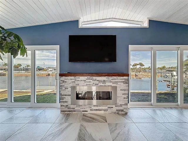 a kitchen with granite countertop a sink stainless steel appliances and cabinets