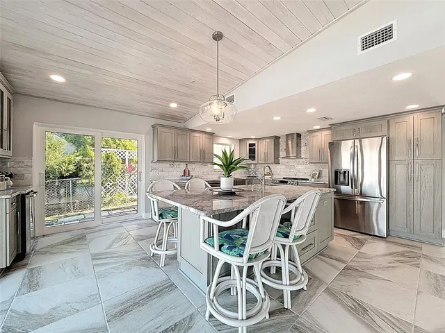 a kitchen with a sink stove and refrigerator