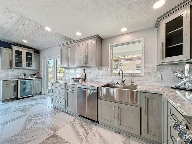 a view of a dining room with furniture and a potted plant