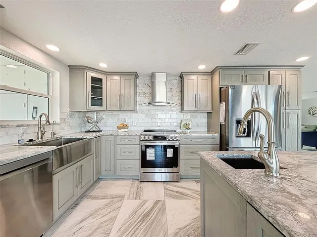 a white toilet sitting next to a bathroom sink