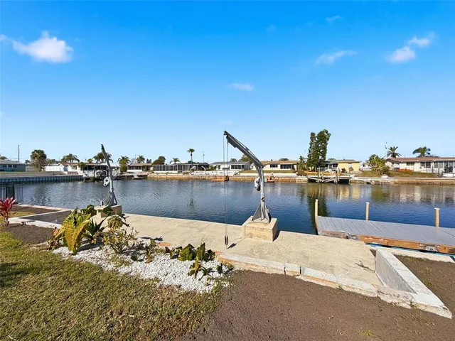 an aerial view of a houses with a lake view