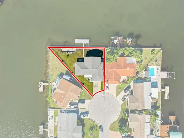 a view of house with large swimming pool and outdoor seating