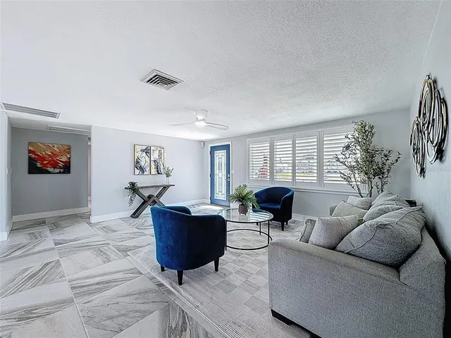 a kitchen with stainless steel appliances granite countertop a stove and a refrigerator