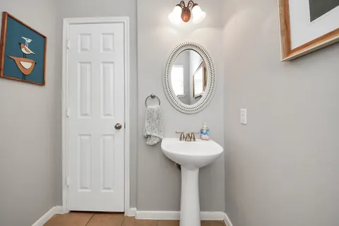 a bathroom with a sink and mirror