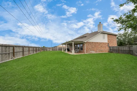 a backyard of a house with lots of green space
