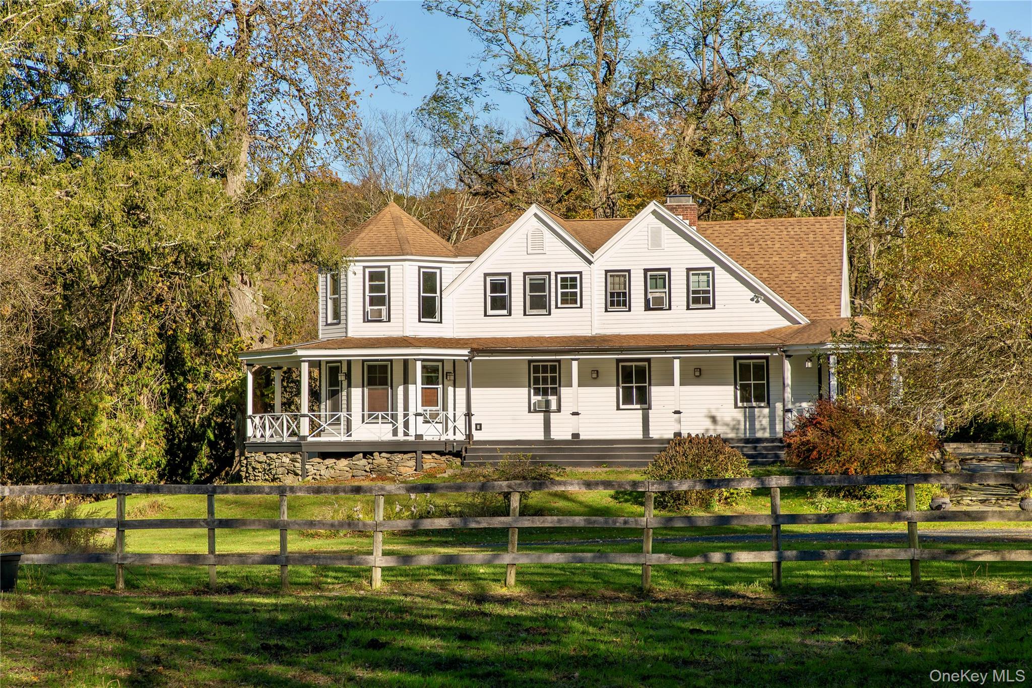 a front view of a house with a yard table and chairs