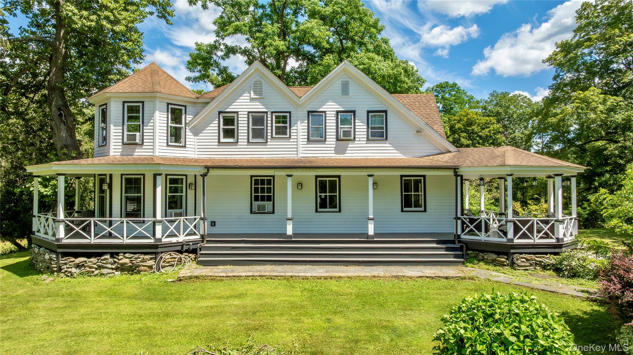 729 Cold Spring Road Stanfordville, NY 12581 - Photo 11 of 47 a front view of a house with a yard table and chairs