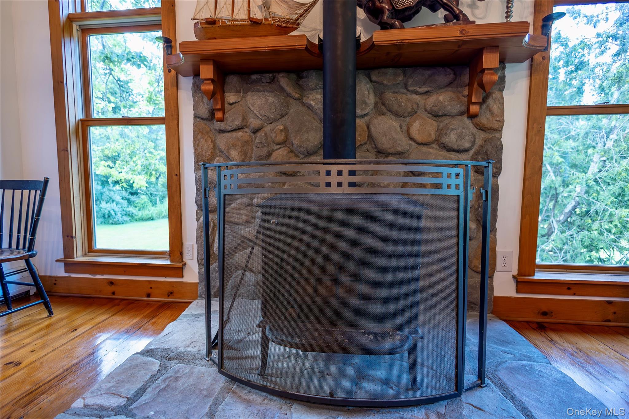 729 Cold Spring Road Stanfordville, NY 12581 - Photo 19 of 47 Detailed view of wood finished floors and a fireplace