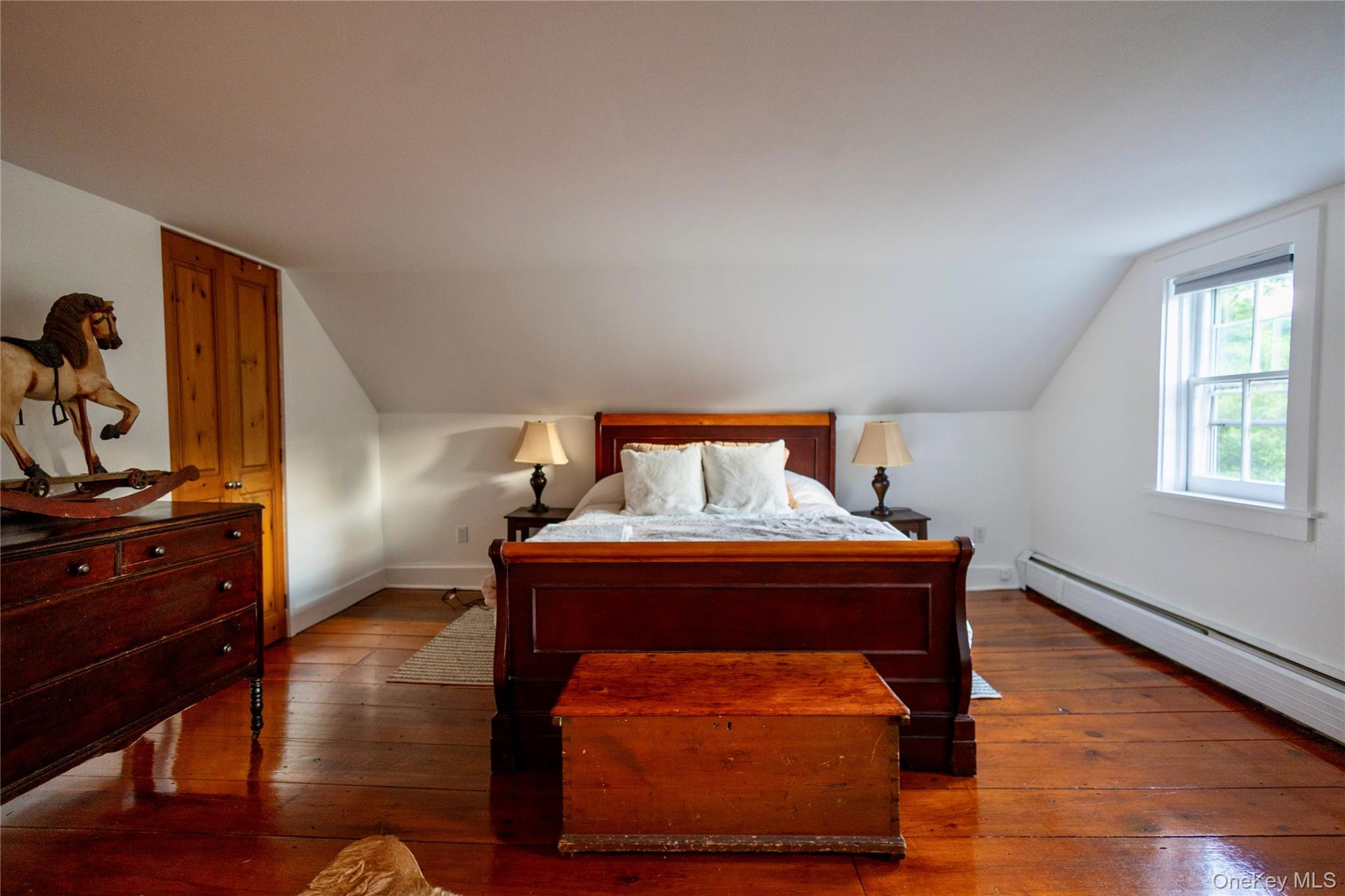 729 Cold Spring Road Stanfordville, NY 12581 - Photo 31 of 47 Bedroom featuring hardwood / wood-style floors, lofted ceiling, and a baseboard heating unit