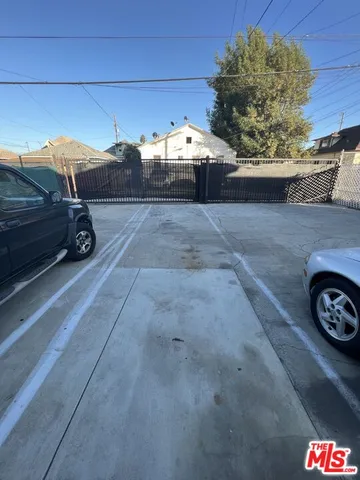 a view of a car parked front of a house