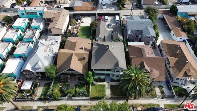an aerial view of houses with outdoor space