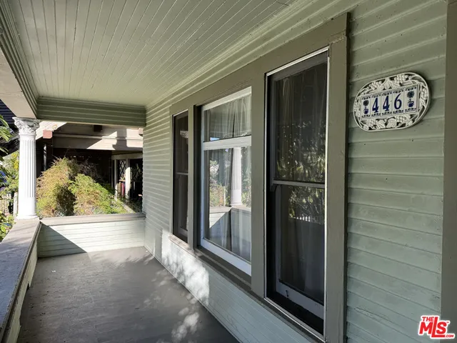 a view of water heater room with wooden floor