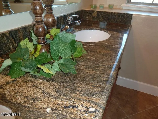 a kitchen that has a sink and a stove