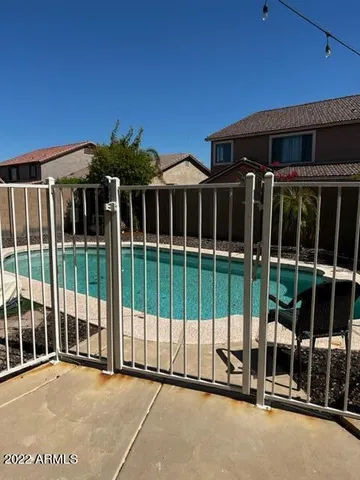 a view of a house with a large window and floor to ceiling window