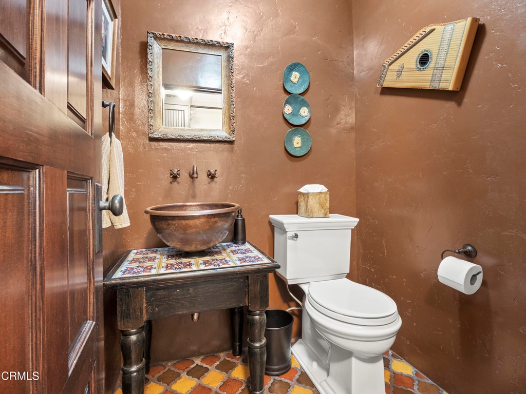 1505 Carroll Drive Altadena, CA 91001 - Photo 12 of 40 a bathroom with a toilet a sink and mirror